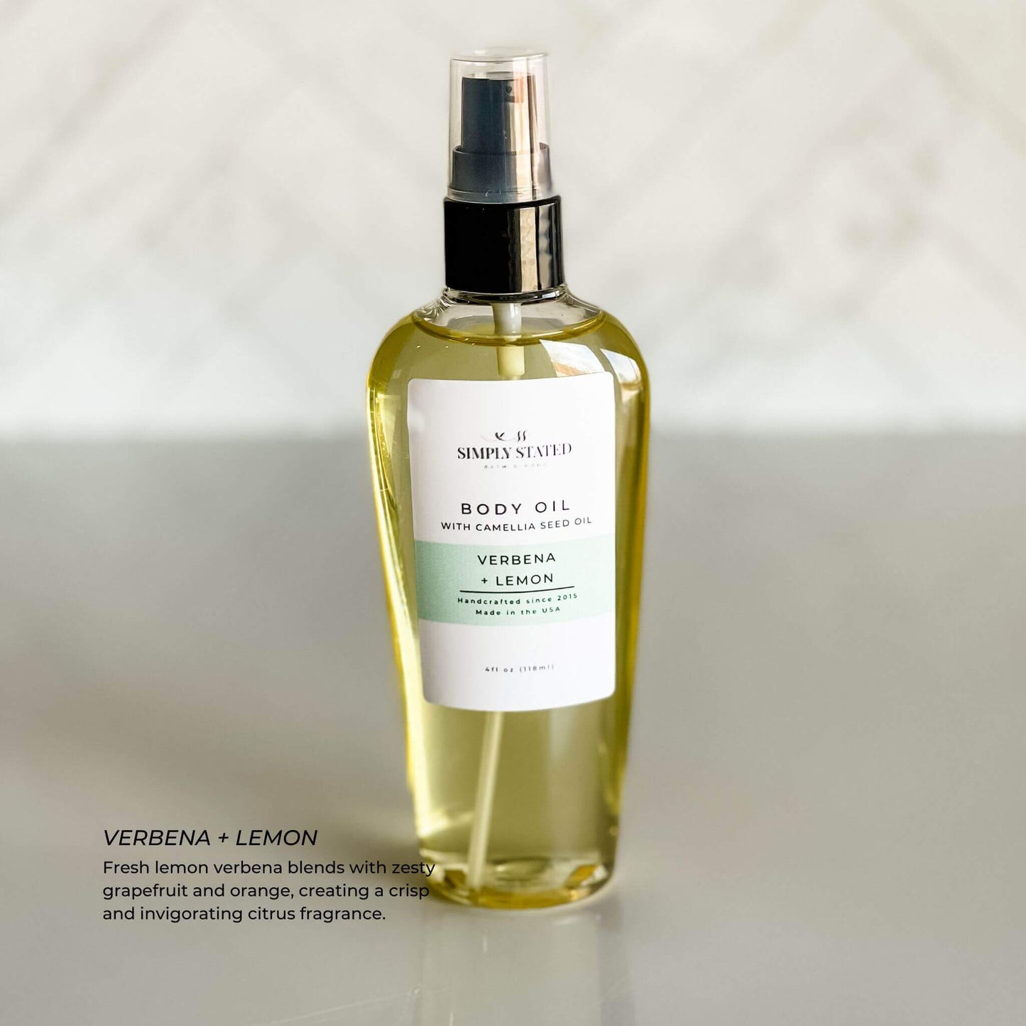 Simply Stated Body Oil in Verbena + Lemon scent with camellia seed oil, providing nourishing moisture and a crisp citrus fragrance.
