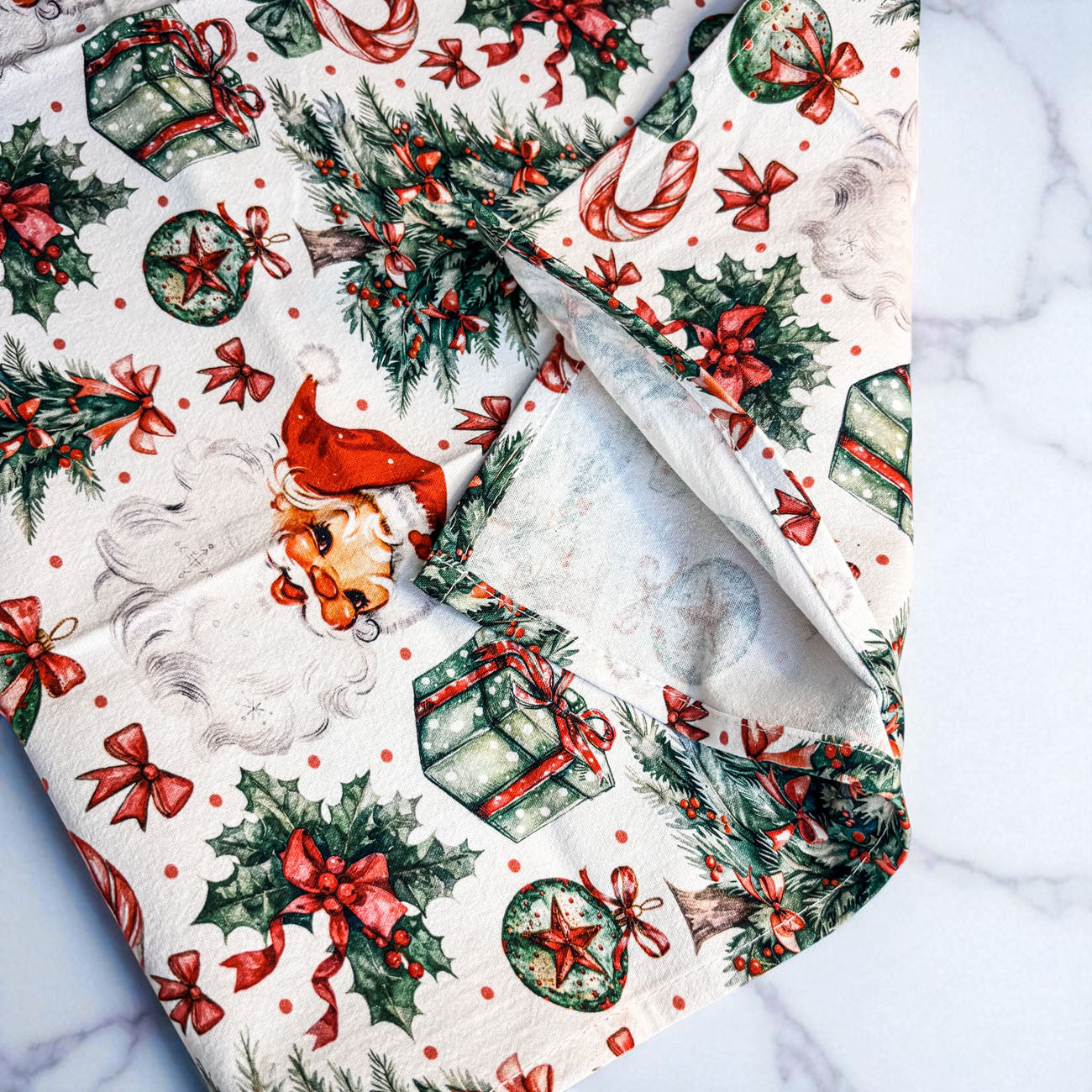 christmas kitchen towel with santa trees gifts bows and ornaments pattern
festive holiday dish towel with traditional christmas icons and design
cozy christmas kitchen towel for decorating holiday themed kitchen
holiday towel with santa candy canes ornaments and christmas trees
christmas dish towel for farmhouse kitchen holiday decor styling