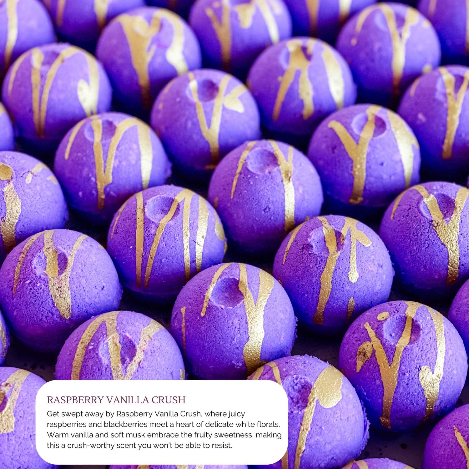 Purple round bath bombs with gold drizzle design, scented with Raspberry Vanilla Crush, part of Sweet Temptations Collection.