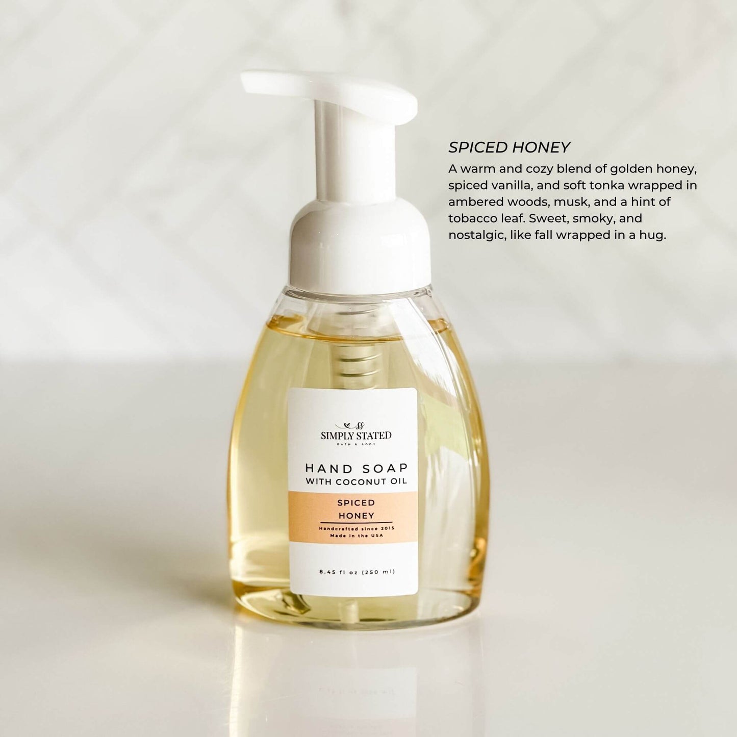 Spiced Honey Hand Soap with golden label and cozy vanilla scent profile