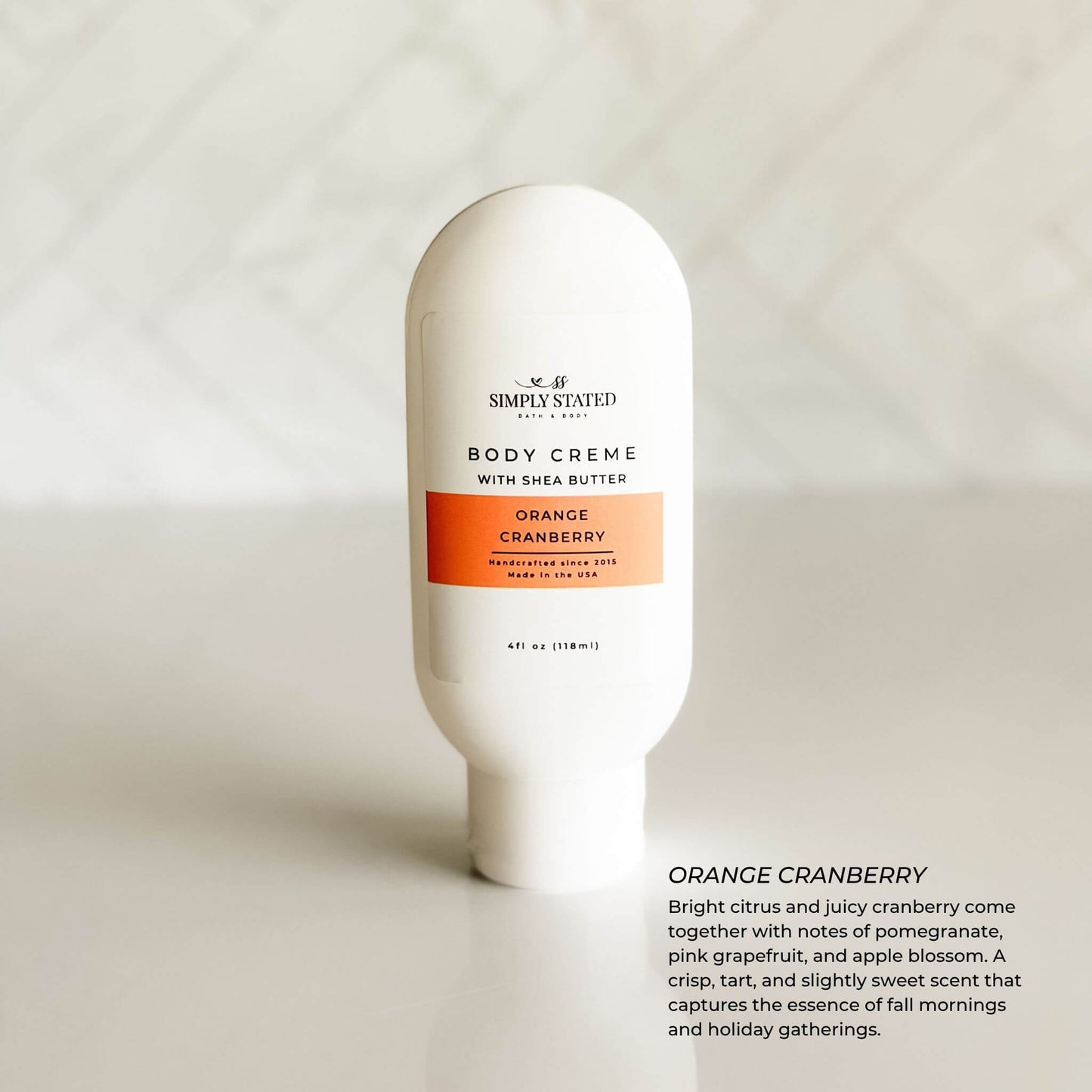 Orange Cranberry Body Crème – citrus and tart cranberry lotion in 4oz white bottle