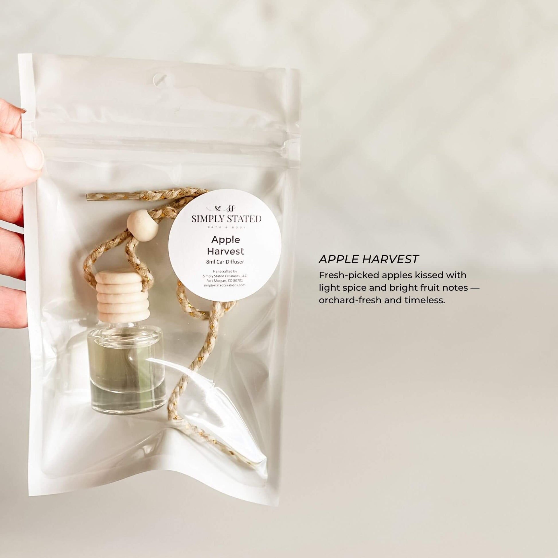 Apple Harvest perfume bottle with packaging on a light background