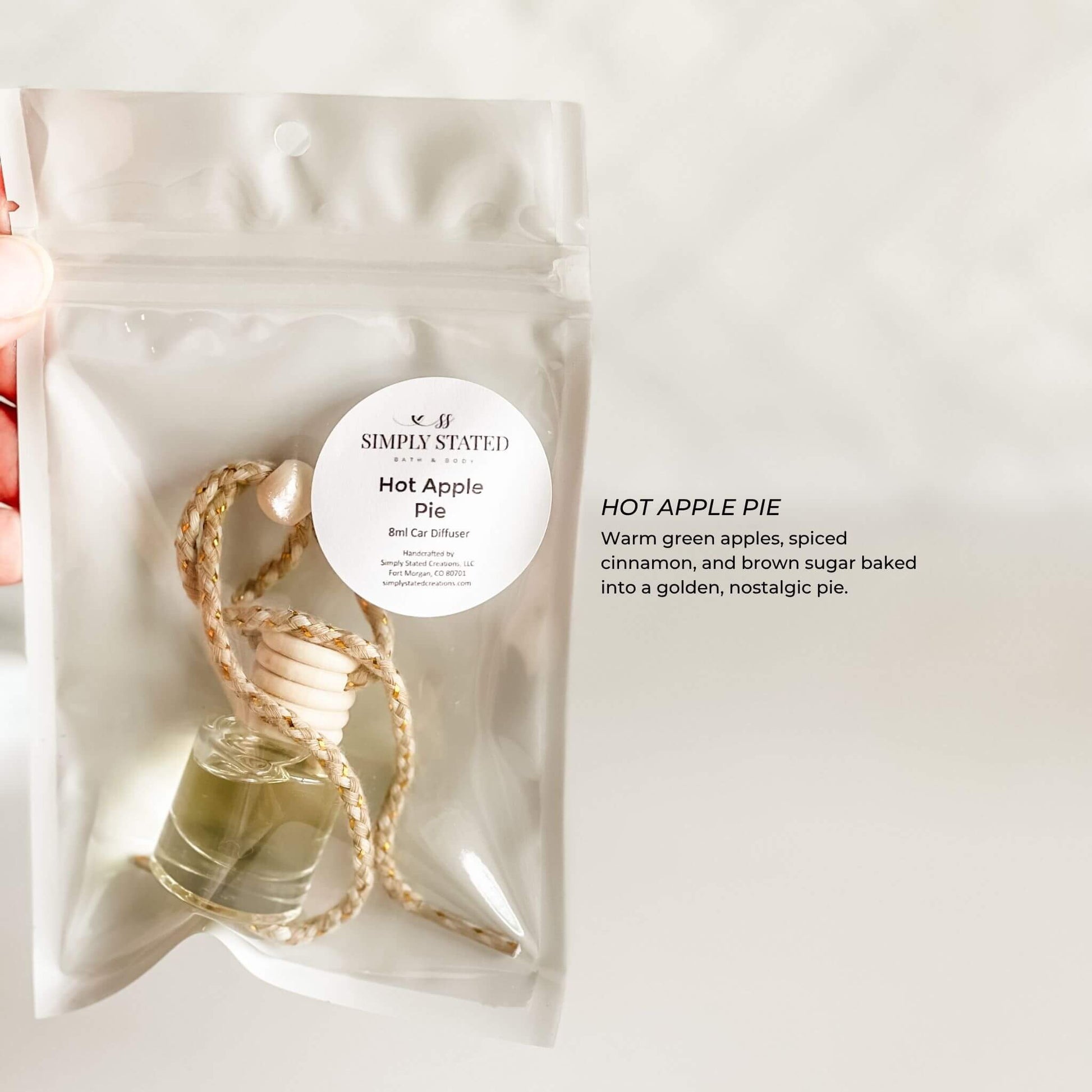 Bag of 'Hot Apple Pie' car diffuser with a label on a white background