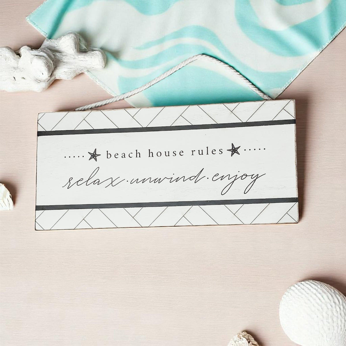 Modern beach house sign with starfish design and geometric pattern