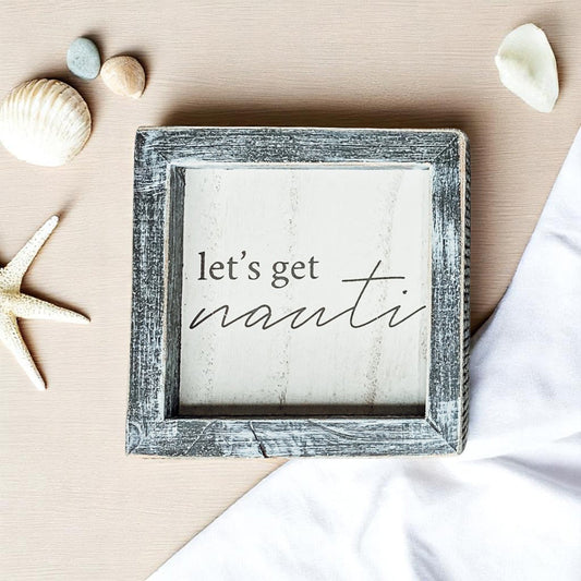 Let's get nauti wooden sign with distressed gray frame
Nautical quote sign with coastal decor and seashells