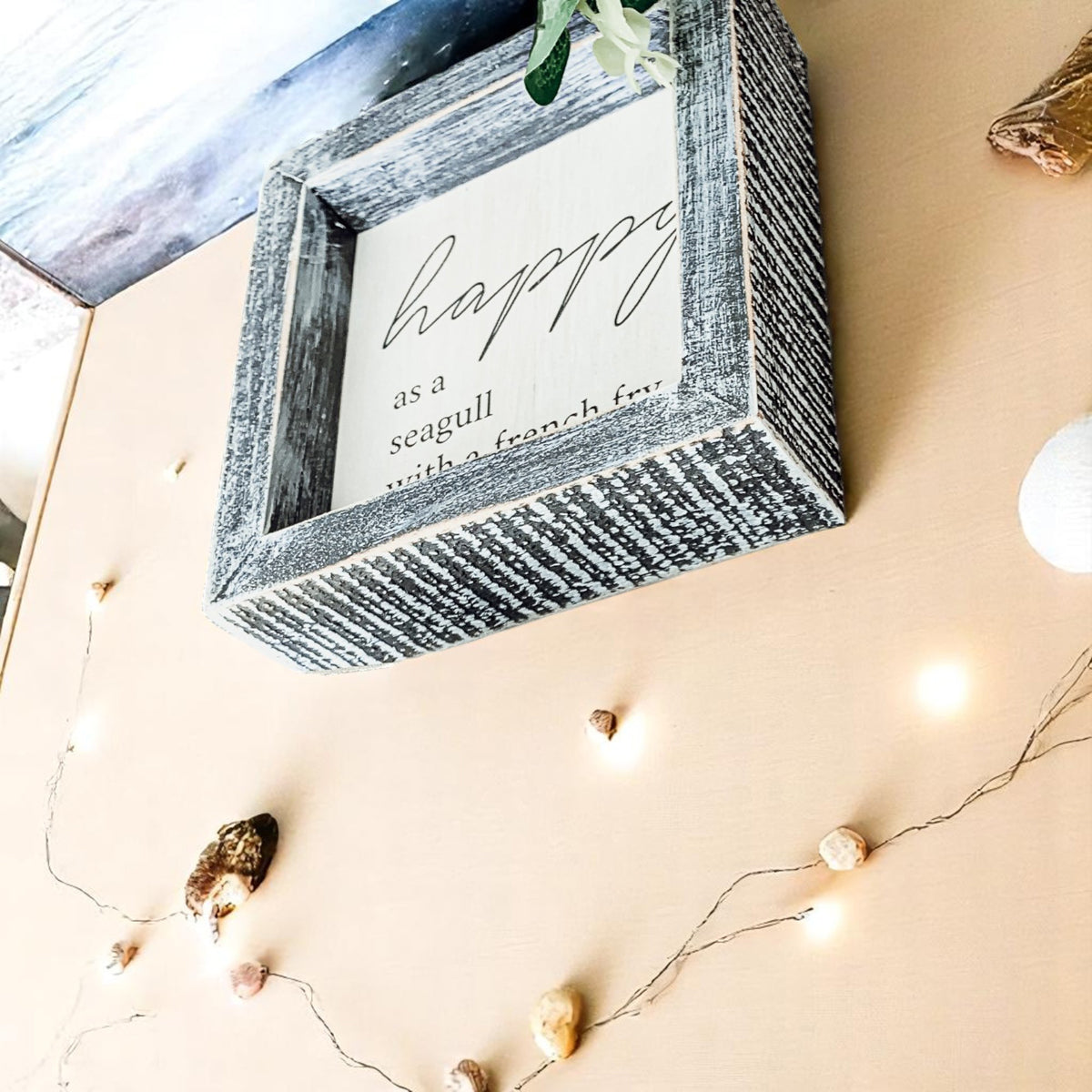 Beach house wall decor with humorous bird quote
Gray framed beach quote sign for coastal decor