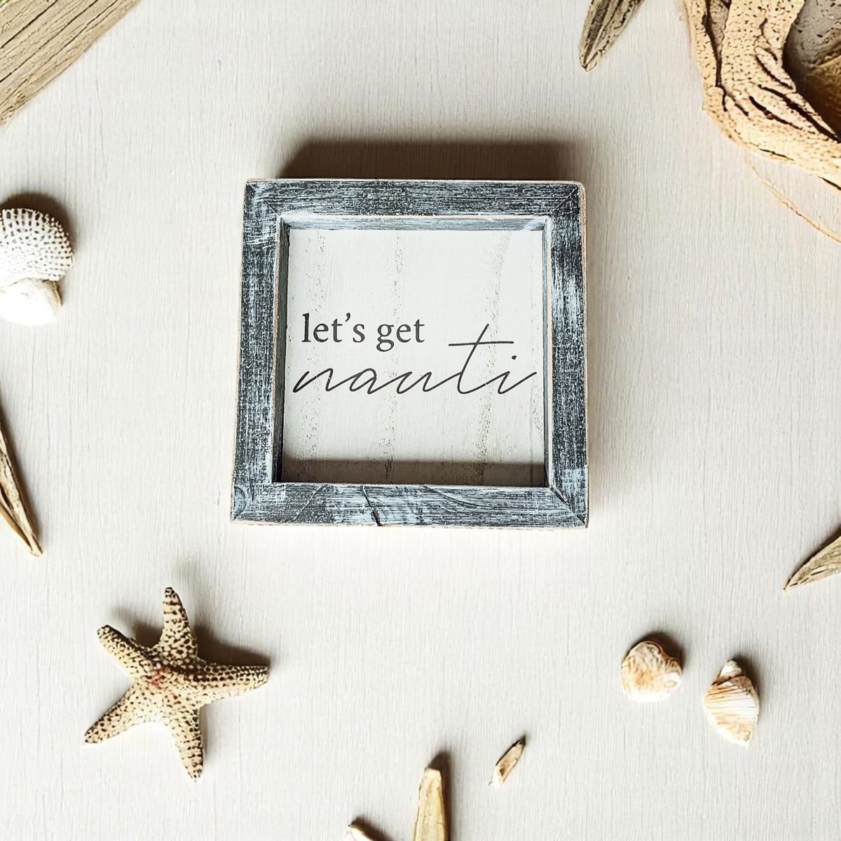 Beach house bar wall decor with nautical humor
Coastal home wall art with sailing theme