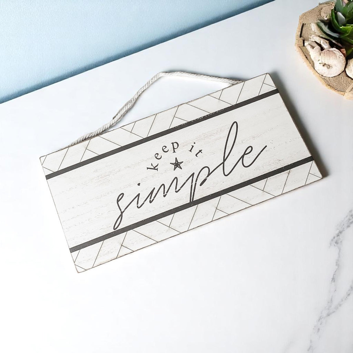 Coastal wall art with simple life message
Modern farmhouse beach sign with geometric details