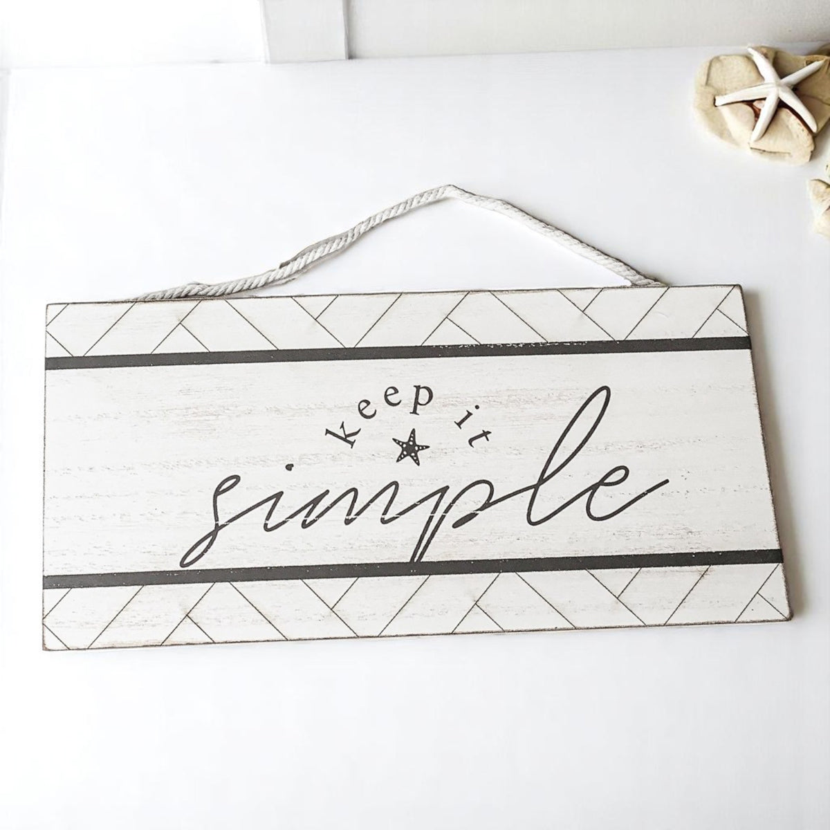 Keep it simple wooden beach sign with geometric pattern and rope hanging