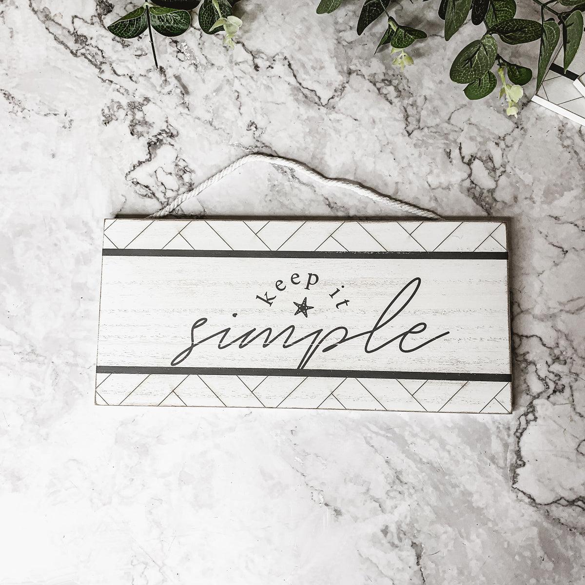 Keep it simple wooden hanging sign, white distressed
Contemporary coastal decor with nautical rope hanging