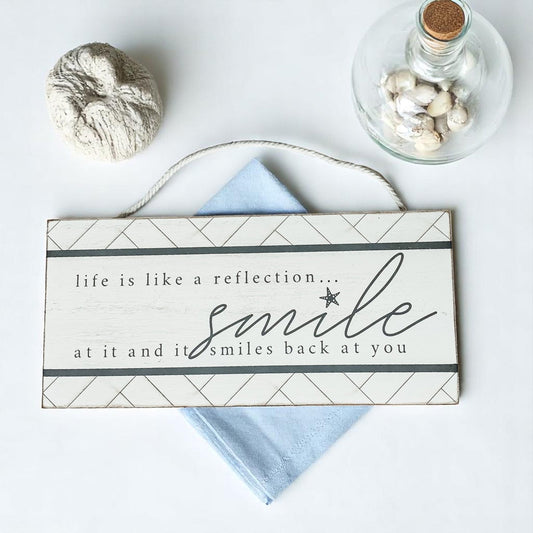 Cute inspirational coastal wall decor with rope hanging