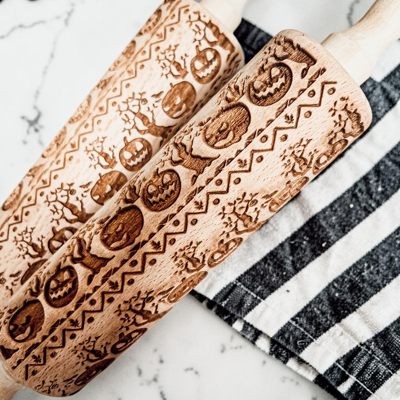 engraved wooden rolling pin fall baking accessory
Halloween rolling pin styled with kitchen towel
pumpkin rolling pin product photography farmhouse style
Halloween baking setup rolling pin and cookies
wooden rolling pin Halloween gift idea
fall cookie rolling pin with pumpkin design