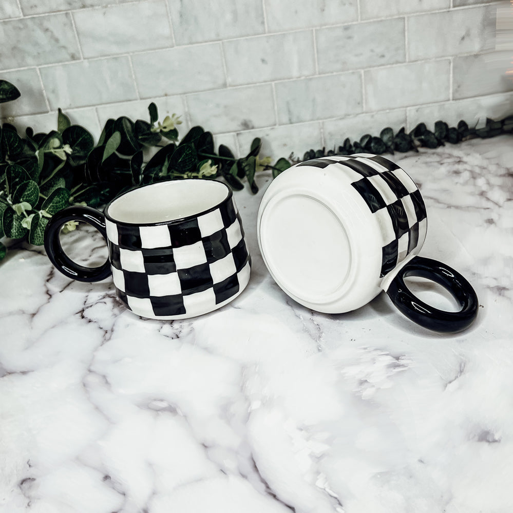 Checkerboard pattern coffee cups black and white