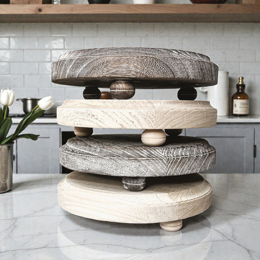 round wooden riser stand on kitchen counter
rustic distressed round wood pedestal tray
natural wood round tray stand with feet
farmhouse style wooden riser for candles
round wooden pedestal tray for kitchen decor