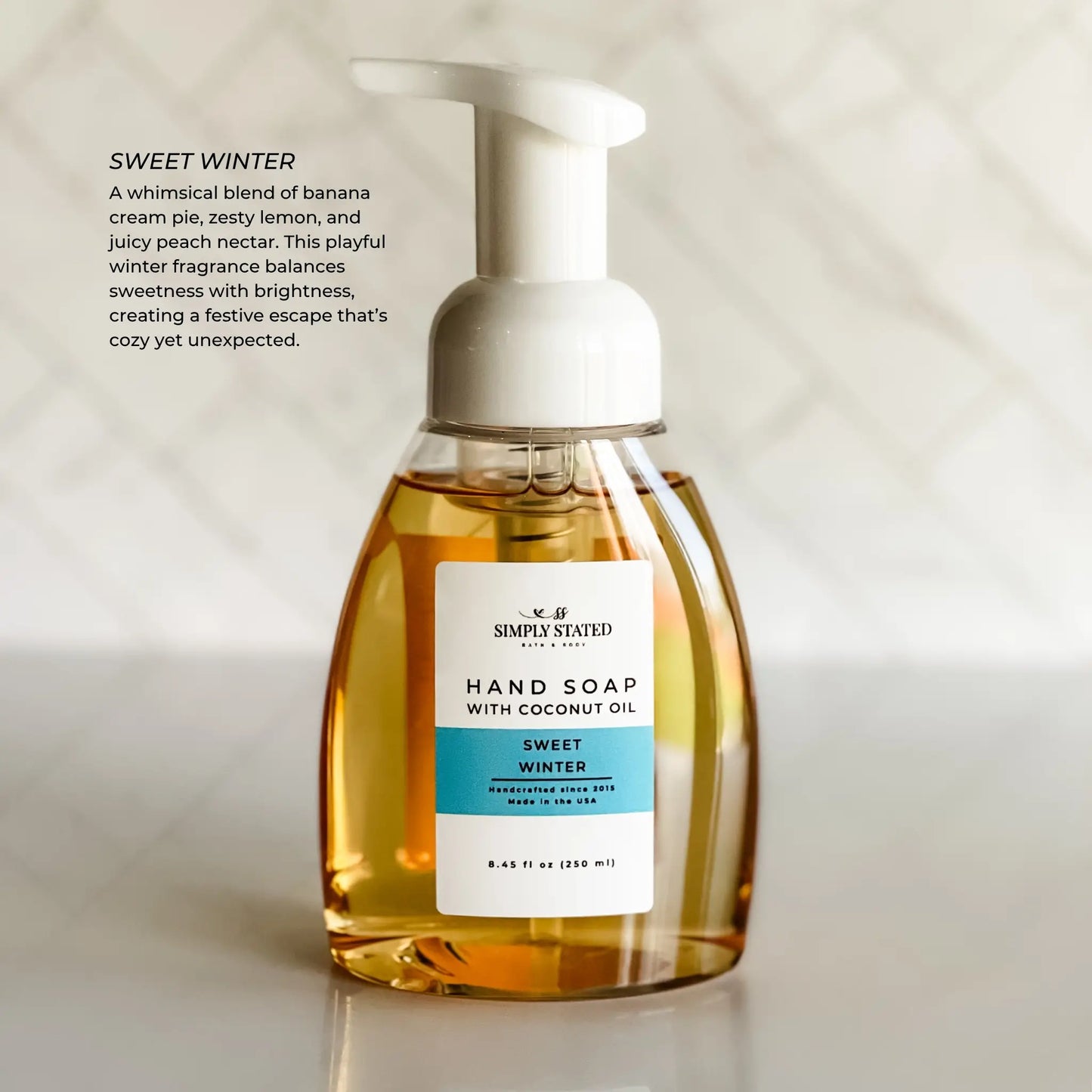 Hand soap bottle with a label on a light background