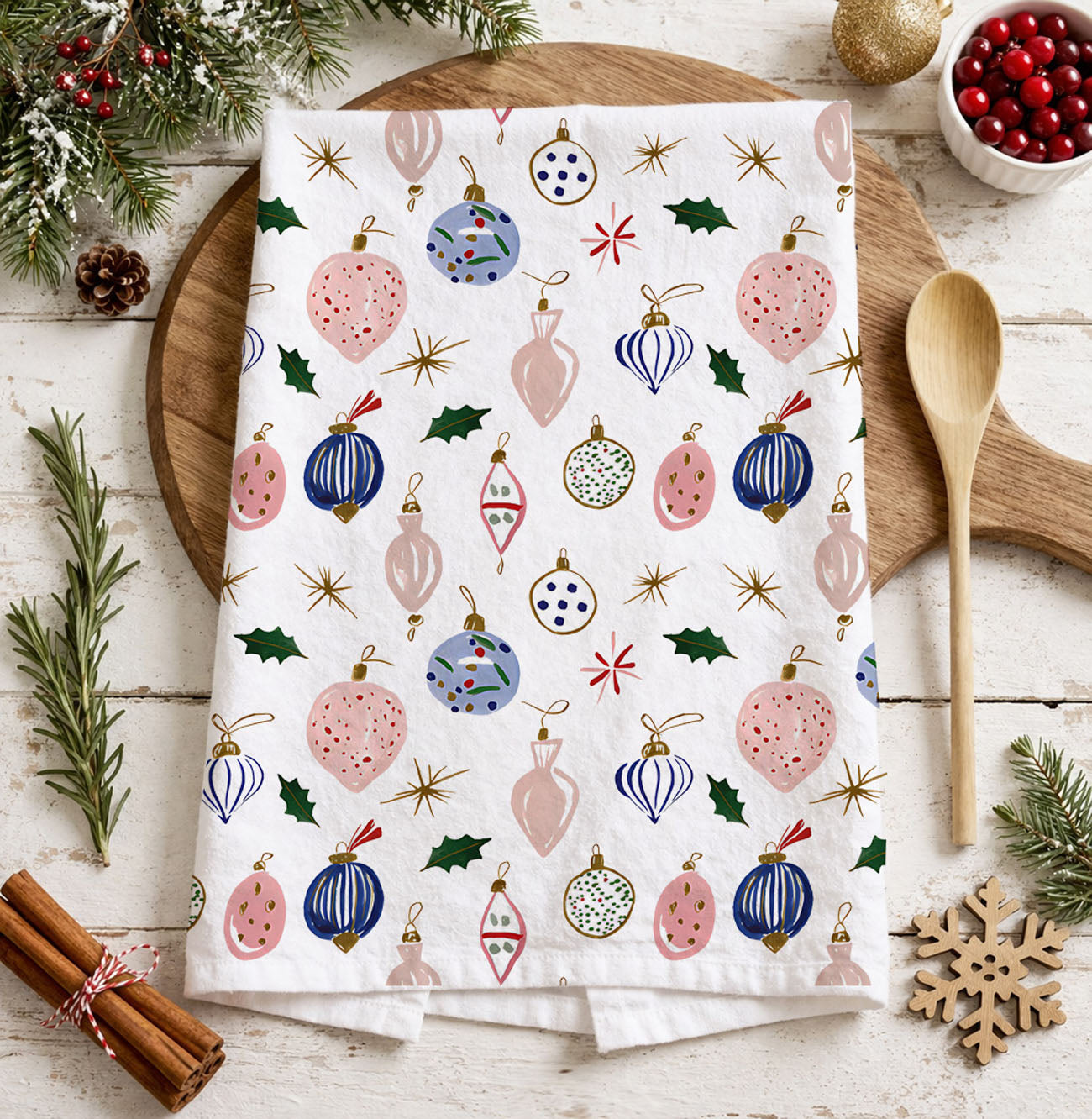 christmas dinner table prep kitchen towel
white kitchen towel christmas pattern ornaments
light neutral christmas kitchen towel decor
subtle christmas decor towel farmhouse kitchen