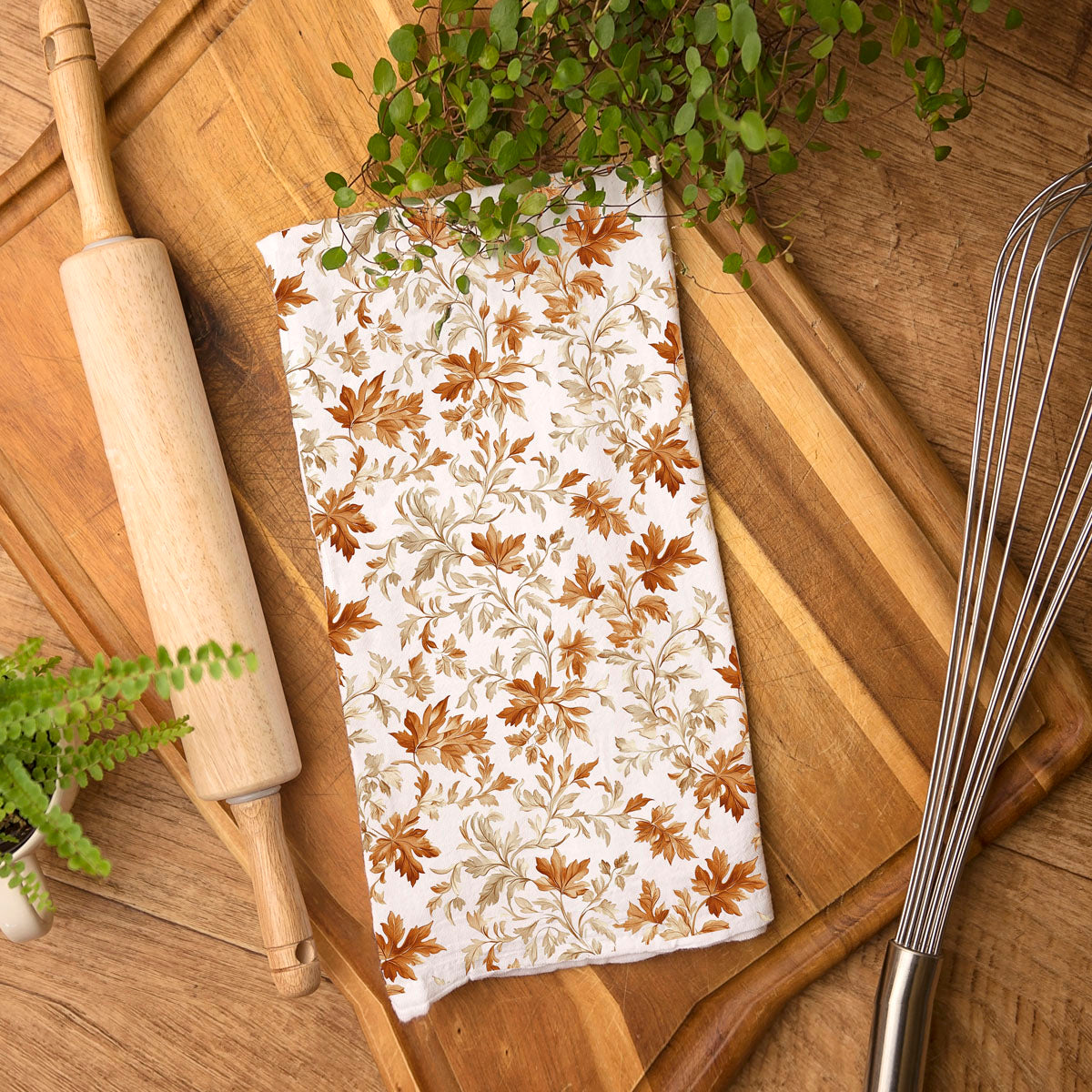 thanksgiving cotton hand towel with leaf design
fall foliage kitchen decor towel on counter
rustic autumn leaf dishcloth for seasonal baking
orange and brown leaf print fall tea towel
cozy autumn kitchen textiles with leaf towel
