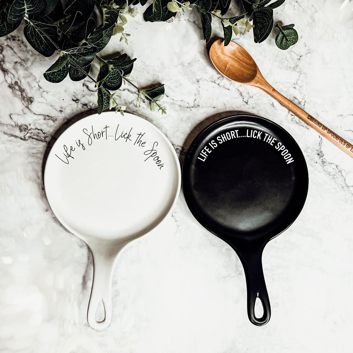 Humorous baking gift set featuring ceramic spoon rest and wooden utensil
Black and white ceramic spoon rest options with motivational baking quote
