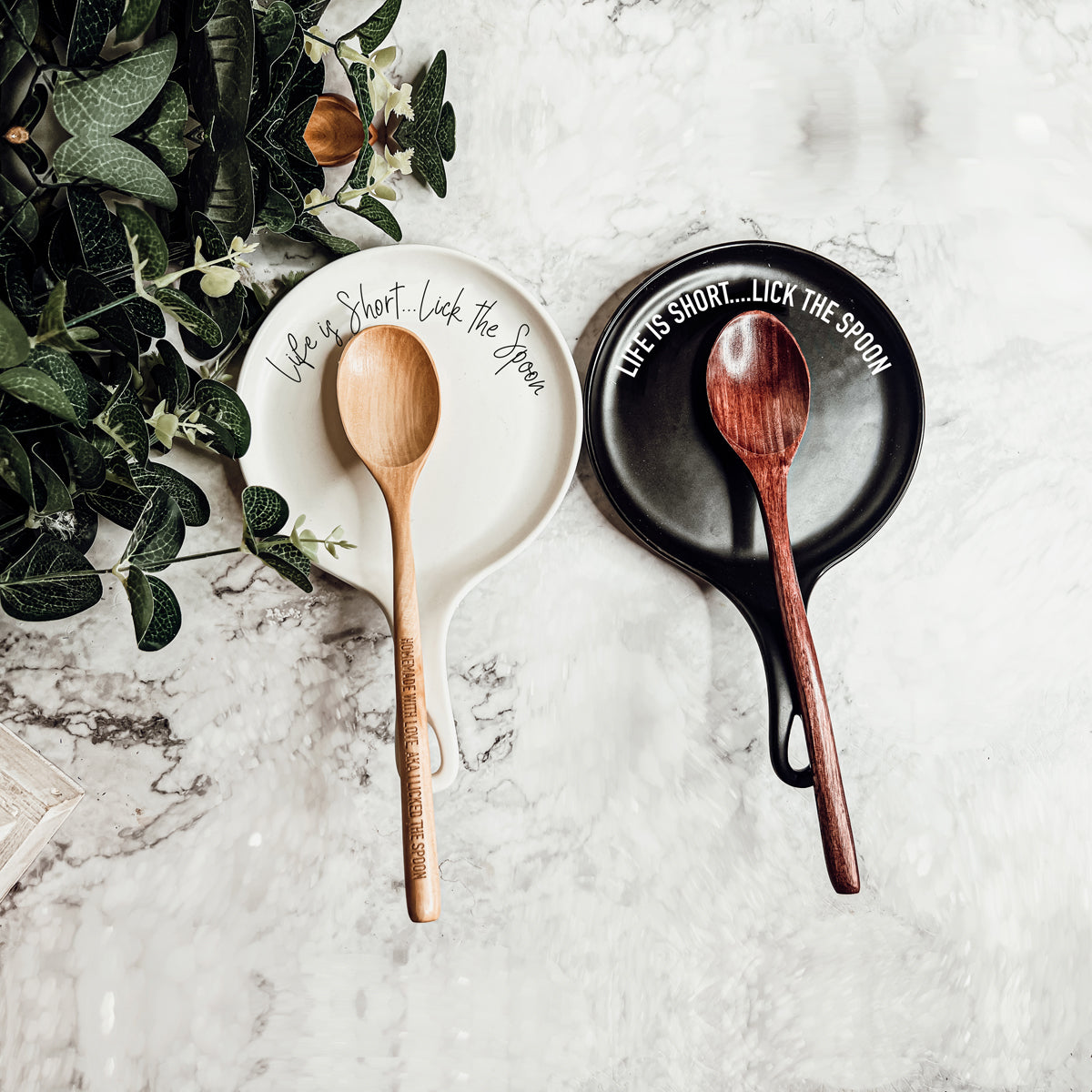 White ceramic spoon rest with Life is Short Lick the Spoon quote and matching wooden spoon gift set
Black ceramic spoon rest with humorous baking quote and wooden spoon gift set