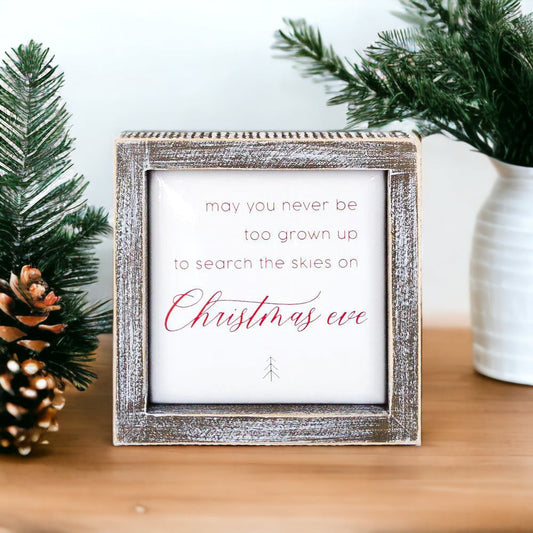 may you never be too grown up to search the skies on Christmas eve sign