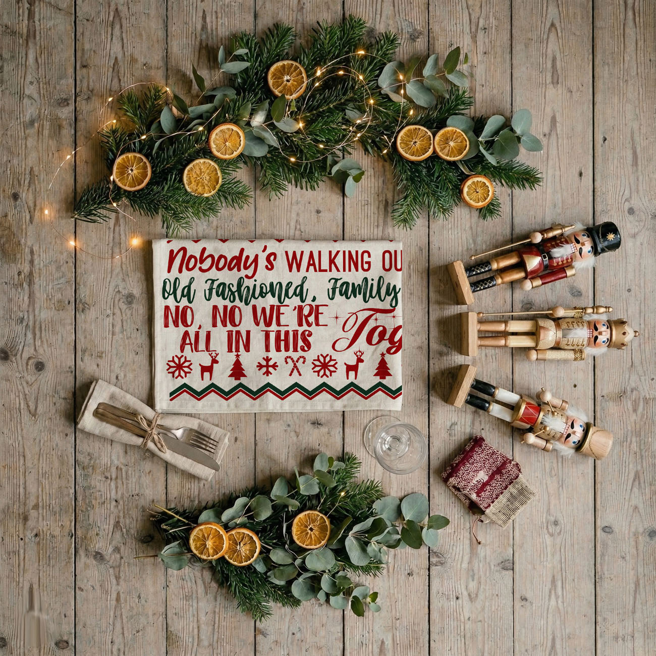 christmas towel displayed in winter decorated home
holiday towel styled with lights garland and decor
kitchen towel funny quote lifestyle christmas setting
festive towel styled farmhouse christmas background