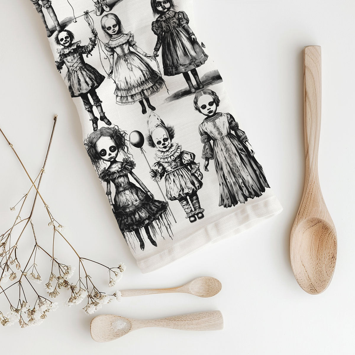 horror movie fan halloween kitchen towel with dolls
creepy porcelain doll print towel for haunted house décor
unique halloween towel with black and white clowns