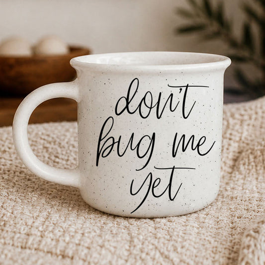 White ceramic coffee mug with dont bug me yet quote in modern calligraphy