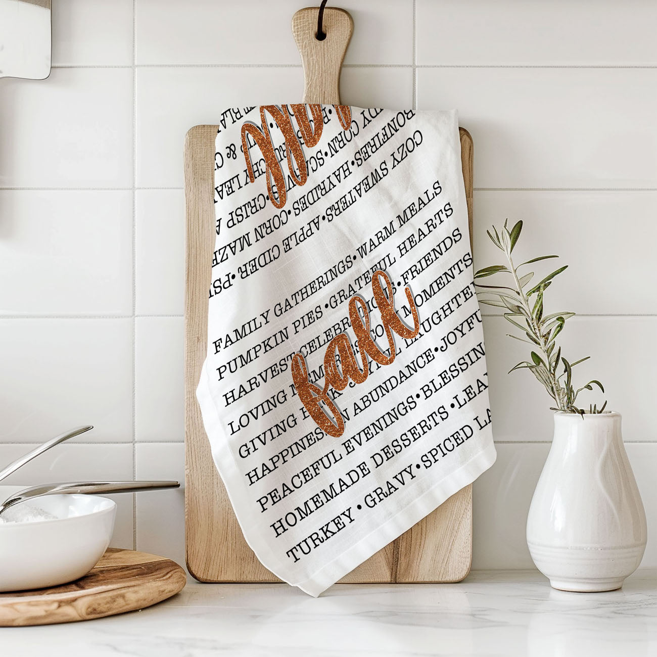fall home styling using typography flour sack towel
seasonal fall kitchen towel with list of autumn traditions
autumn phrase towel paired with pumpkins and candles
fall dish towel for pumpkin spice and sweater weather fans