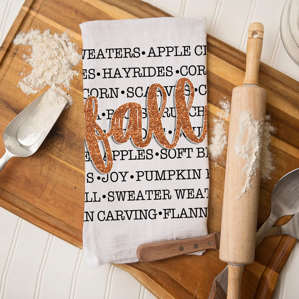 Fall typography kitchen towel on rustic wood background
autumn sayings cotton towel for cozy farmhouse home
fall word art flour sack towel 
seasonal text kitchen towel with orange glitter fall script