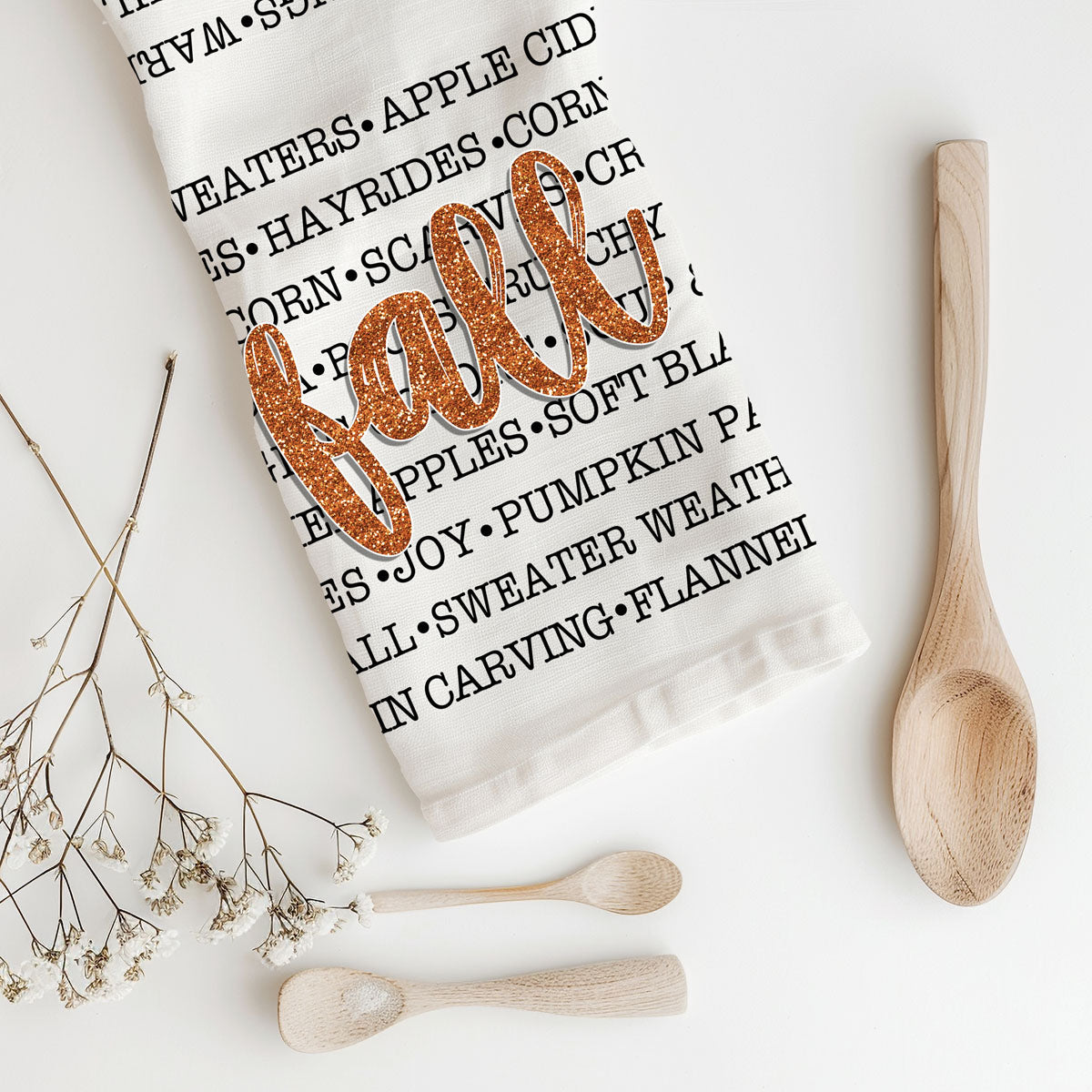 fall words flour sack kitchen towel
autumn typography dish towel with glitter fall script
cozy fall phrases kitchen towel for farmhouse décor
white cotton fall tea towel with word art design
autumn baking scene with fall phrases flour sack towel
fall coffee bar decorated with word art kitchen towel
