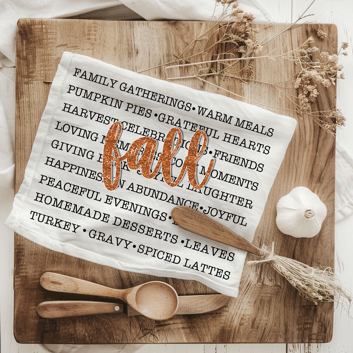 fall phrases towel draped on oven for seasonal décor
autumn kitchen textile with word art and fall script
fall-themed dish towel perfect for thanksgiving gift basket