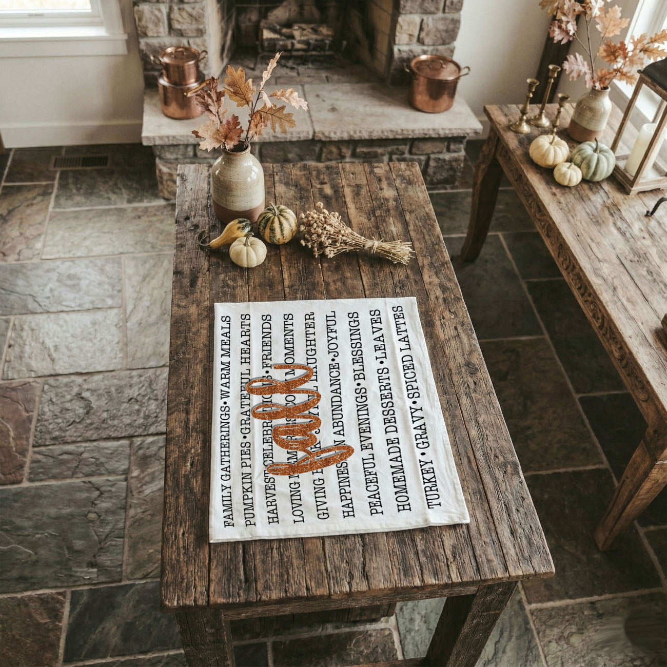 neutral white and black fall text towel for farmhouse kitchen
fall phrase towel styled with rosemary and wooden spoon