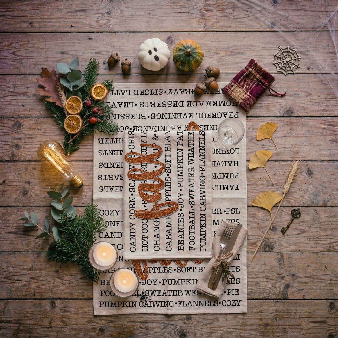 word art fall dish towel styled
neutral white fall towel with bold orange fall script
autumn kitchen accent towel with seasonal sayings
fall baking towel with typography design and glitter effect