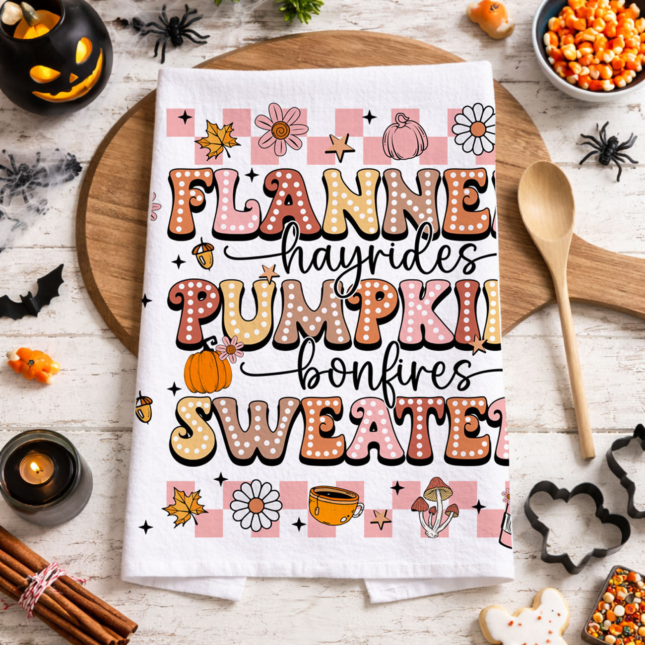 pink october kitchen towel for cozy halloween nights
pink and orange fall and halloween tea towel 
soft pink harvest towel with pumpkins and bonfire mug art
pink fall aesthetic towel for cottagecore halloween décor