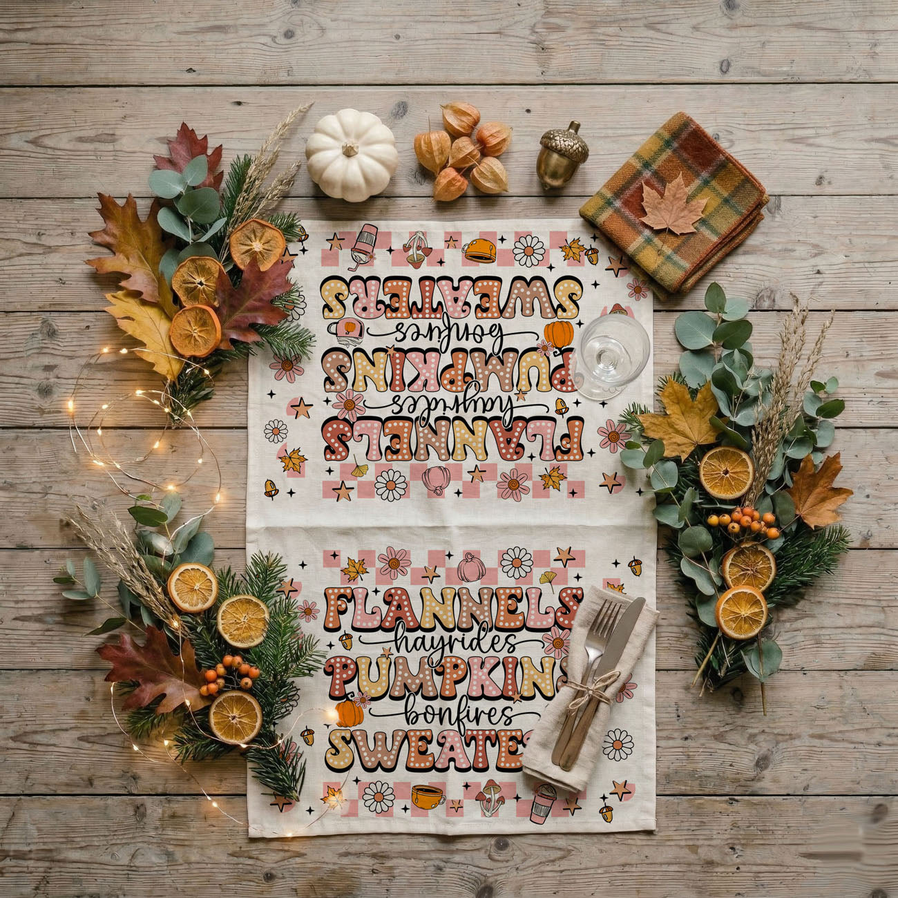 autumn kitchen décor towel with flannels and pumpkins text
pink pumpkin spice kitchen towel for sweater weather lovers
fall tea towel with cute daisies coffee cups and pumpkins
retro fall words dish towel hanging on oven handle
girly pink halloween home gift flannels hayrides towel
