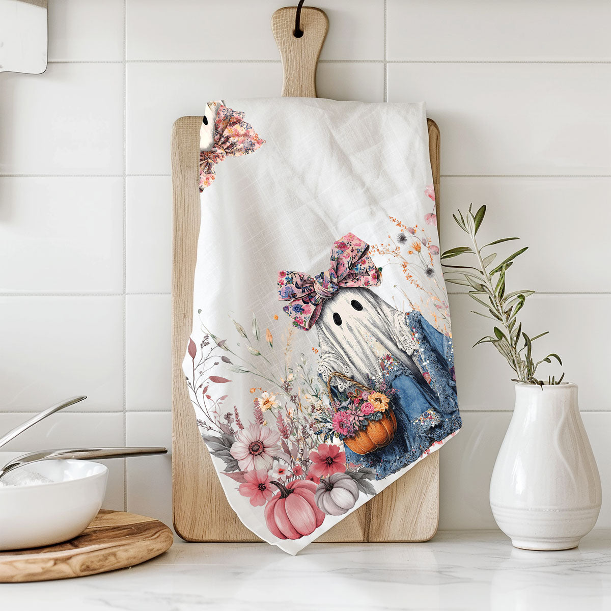 pink ghost kitchen towel for non scary halloween décor
floral ghost hand towel perfect for autumn gifting
cute spooky season towel with girly ghost and florals
ghost holding pumpkin flower basket fall dish towel