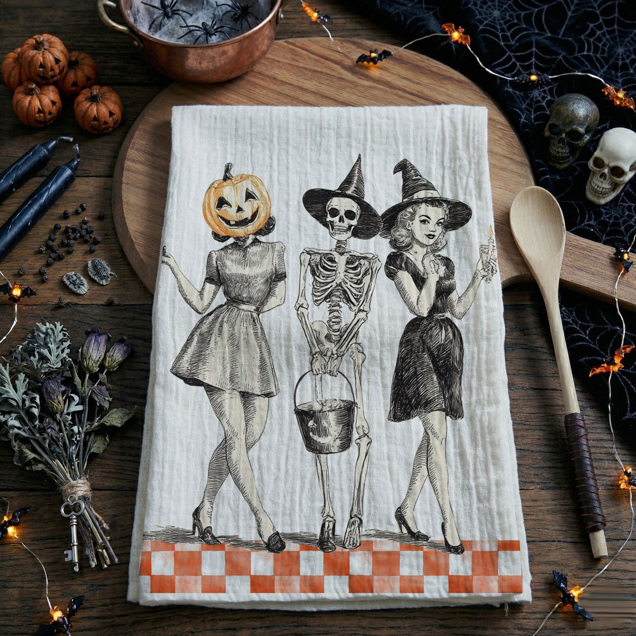 mid century halloween print towel with skeleton trio
vintage halloween hostess gift cotton flour sack towel
retro halloween pinup girls towel for candy bar décor
black and orange vintage halloween tea towel for kitchen
