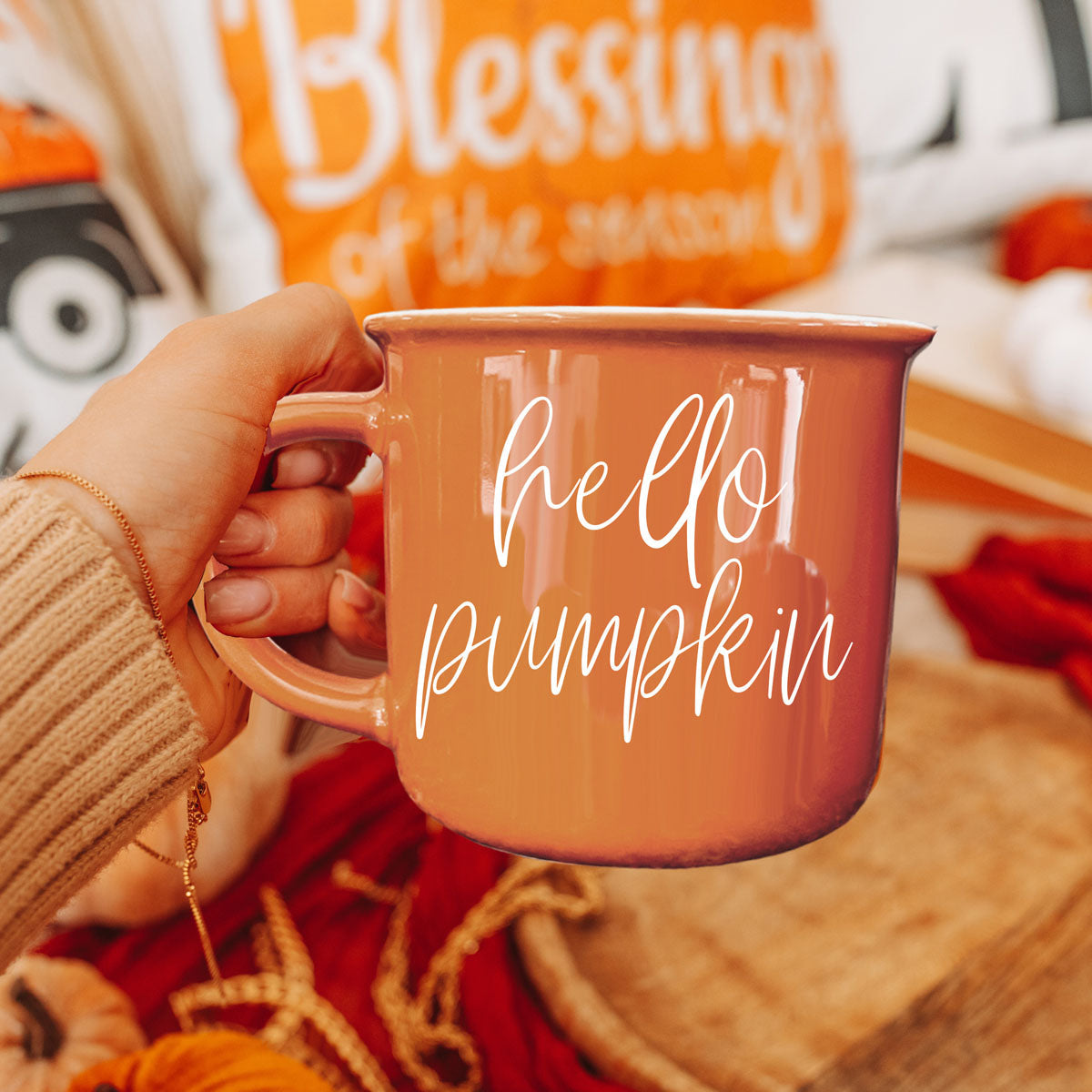 hello pumpkin coffee mug in woman's hands
orange hello pumpkin mug for fall coffee
cozy fall coffee cup with hello pumpkin quote