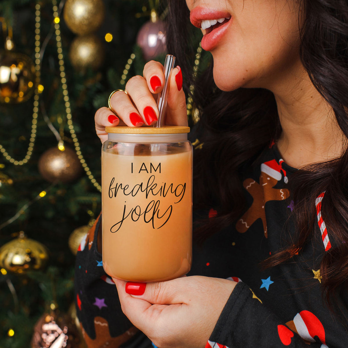 Christmas decor inspired tumbler
festive red and green Christmas coffee cup
holiday themed iced coffee glass
Christmas nails holding glass tumbler
woman holding Christmas coffee tumbler