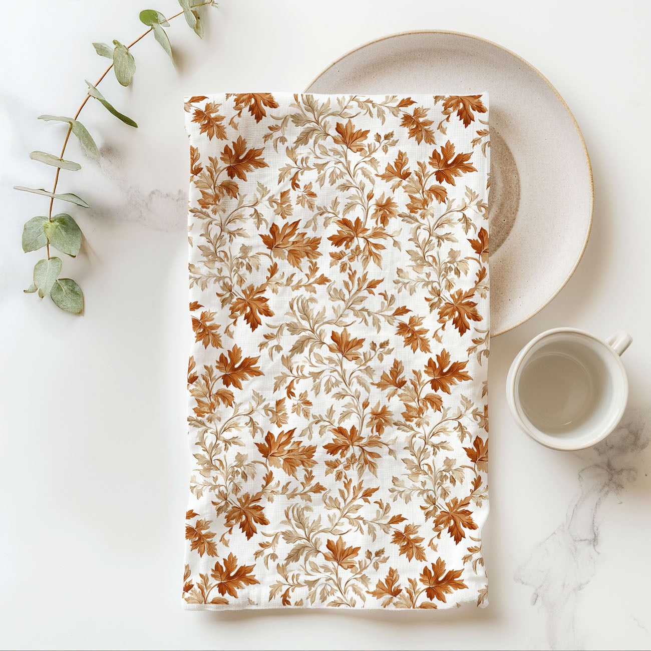 elegant fall leaf pattern tea towel in farmhouse kitchen
flour sack cotton towel with watercolor leaves
fall kitchen textiles autumn leaves printed towel
minimal white and rust leaf design dish towel
fall bar cart decor with autumn leaf kitchen towel