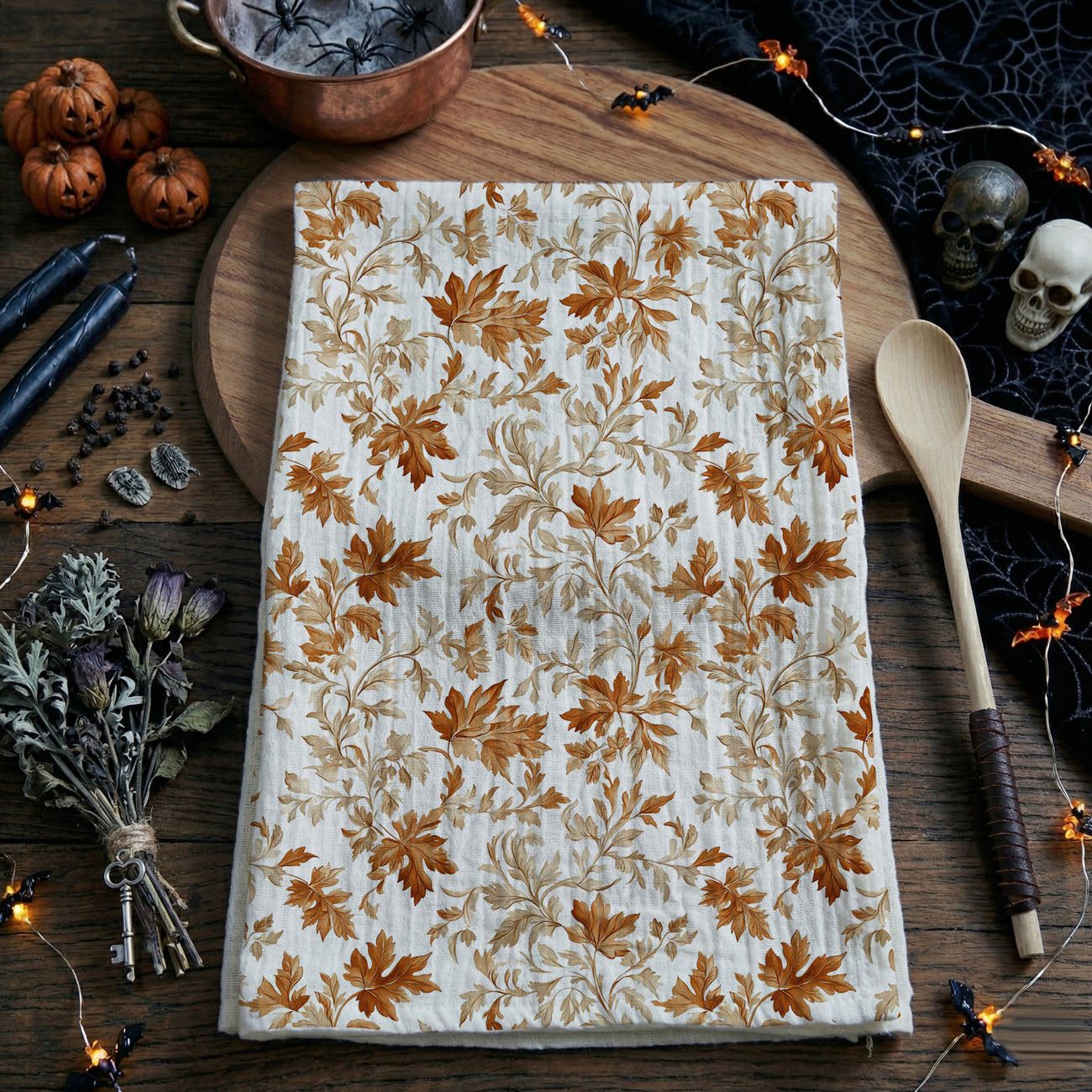 fall leaf print towel for sink and oven handle
seasonal autumn kitchen accent towel in white and rust
pumpkin spice season kitchen towel with leaves
fall kitchen decor idea with leaf cotton towel
flour sack cotton fall dish towel hanging on stove