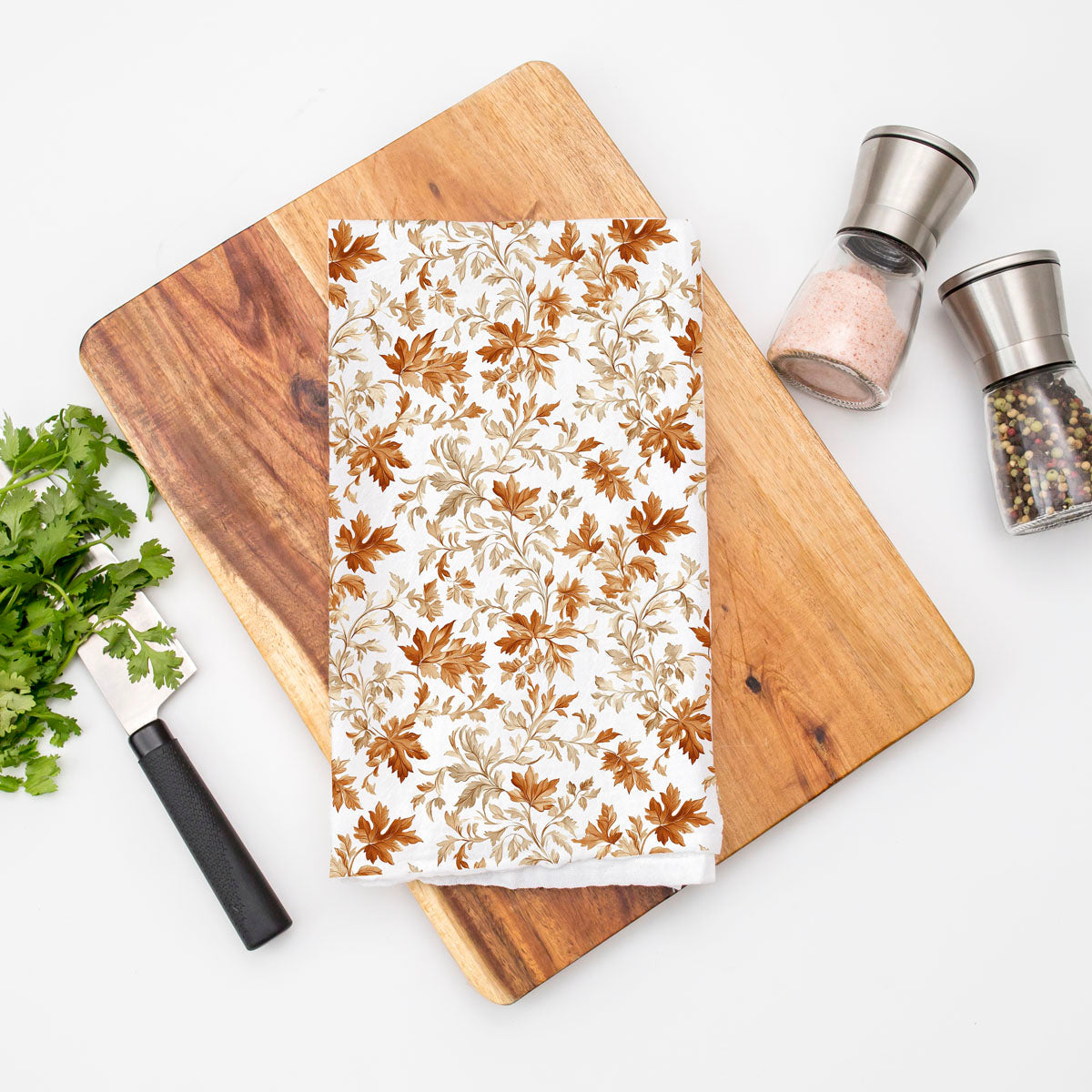 autumn leaves flour sack towel
fall kitchen decor towel on oven handle
autumn leaf print towel 
brown and copper leaf fall dish towel 
soft cotton fall towel for drying dishes and hands
seasonal autumn kitchen towel for thanksgiving baking