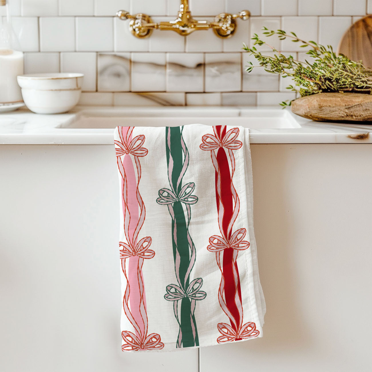 christmas kitchen linen with ribbon bow stripes and soft colors
seasonal christmas cloth towel with bow motif and script text
holiday decorative towel with repeating ribbon stripe pattern
christmas themed kitchen cloth with bows and festive lettering
soft cotton christmas towel with bow stripe holiday design