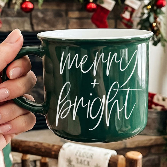 Christmas coffee mug, Merry & Bright mug, holiday ceramic mug, festive coffee cup, Christmas hot cocoa mug, holiday drinkware, Christmas kitchen decor, farmhouse Christmas mug, cozy winter mug, Christmas gift idea, holiday hostess gift, stocking stuffer, coffee lover gift, Christmas coffee bar decor.
Christmas mug with festive phrase and classic colors
Ceramic Christmas mug for home and gift shops