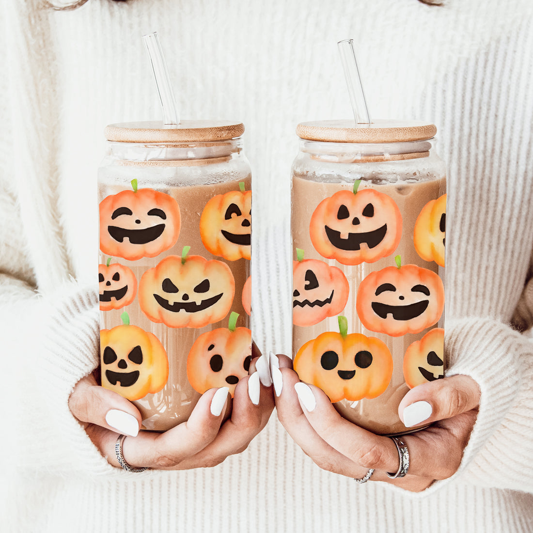 Cute fall pumpkin tumbler with reusable straw and wooden lid
Hand-drawn pumpkin face mason jar style drinking glass