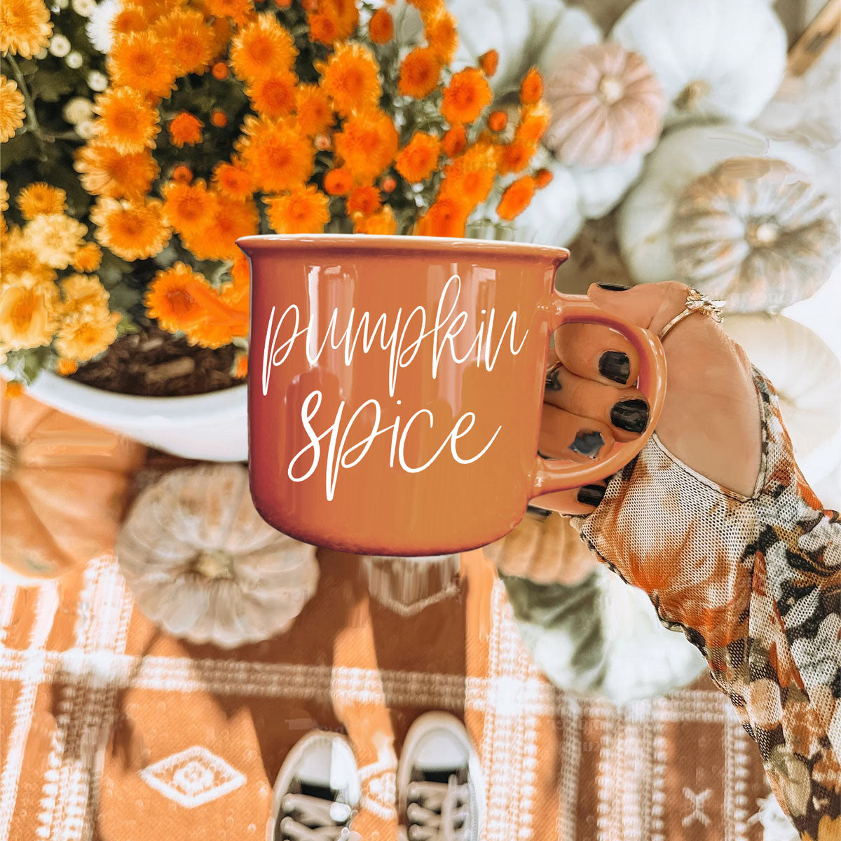 halloween dessert and coffee mug on plate
fall centerpiece tray with mug and pumpkins
autumn reading nook with mug and throw blanket
seasonal orange mug on wooden cutting board