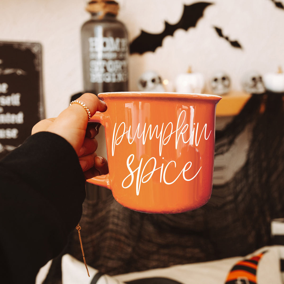 halloween and fall style drinkware for seasonal sippers
autumn girls night in scene with snacks and coffee mug
fall themed gift bundle with mug and treats
hello pumpkin mug for fall coffee bar decor
orange fall mug perfect for PSL pumpkin spice latte