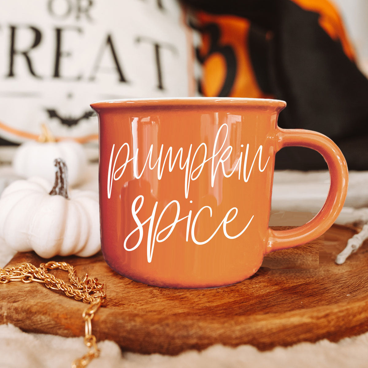 fall table setting with mug and harvest decor
halloween breakfast scene with mug and pastries
cozy autumn porch with orange mug and blanket scarf
fall picnic blanket with mug and apples