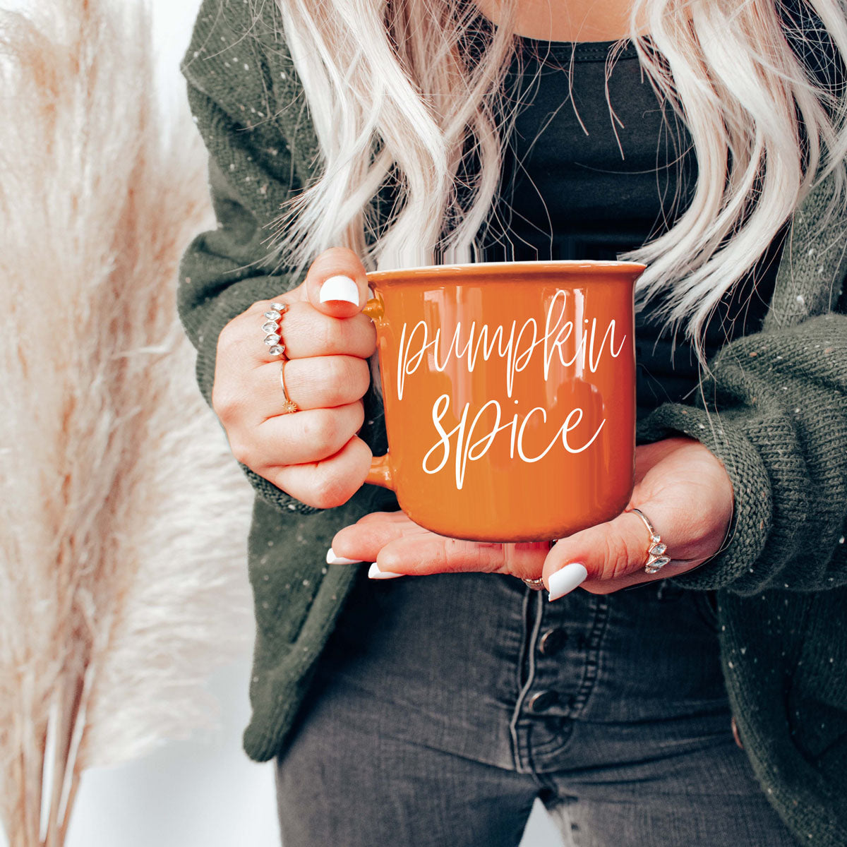cozy fall themed coffee mug on table
autumn orange ceramic mug with warm drink
fall morning routine with seasonal coffee cup
halloween and fall decor with orange mug
cozy couch scene with fall mug and blanket