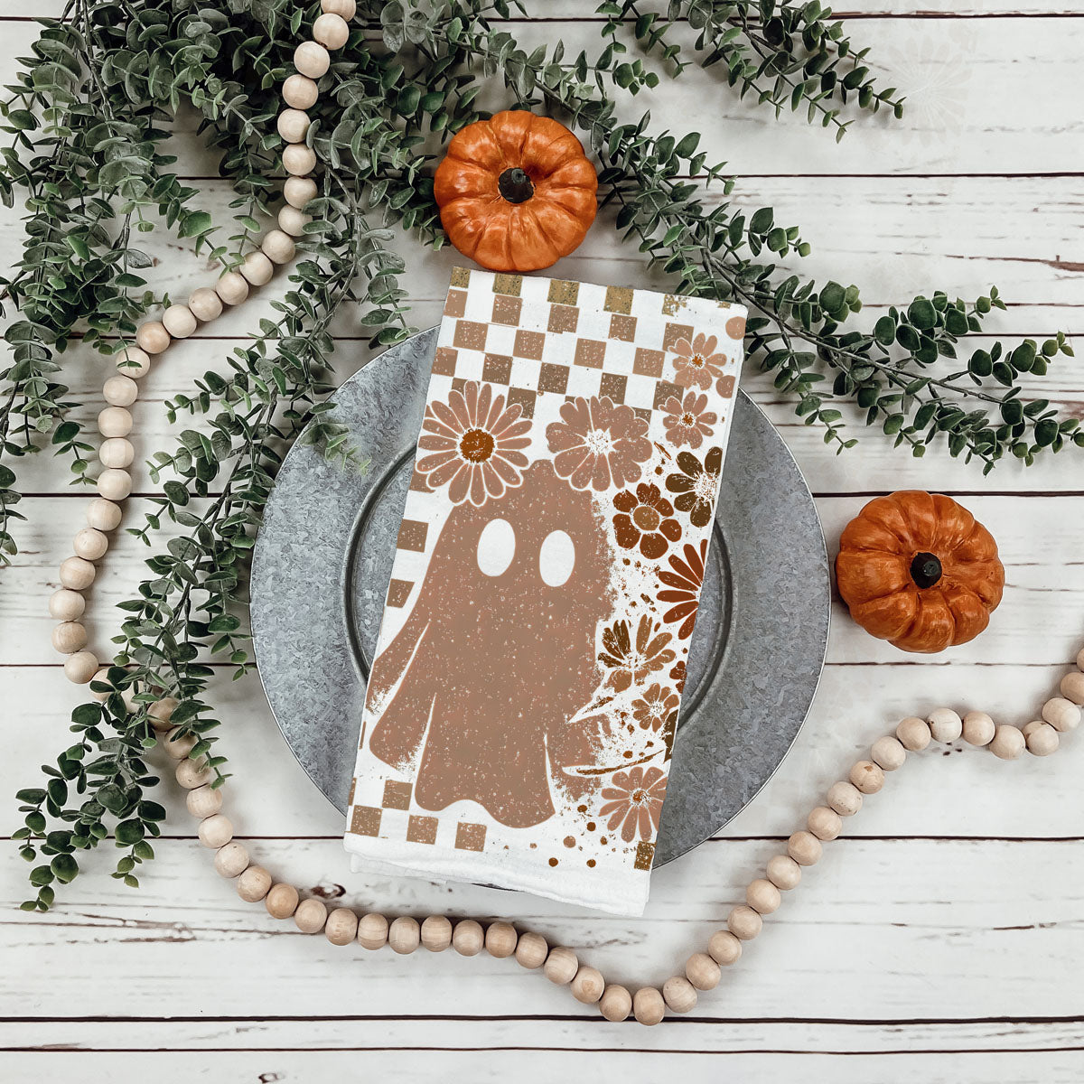 checkered brown halloween towel for rustic kitchen décor
vintage skull and ghost cotton towel for fall gifting
retro fall kitchen towel with skeleton and floral pattern